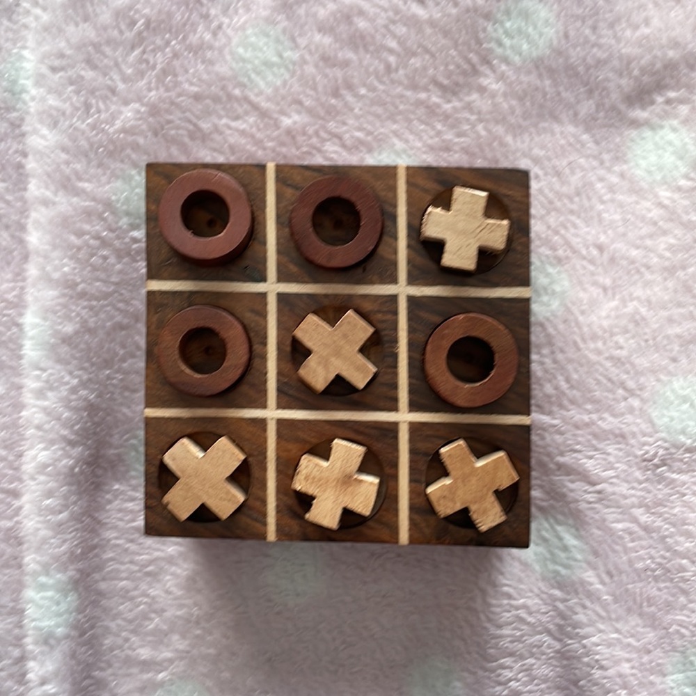 Matr Boomie hand carved Tic-Tac-Toe game where pieces are stored inside the box
